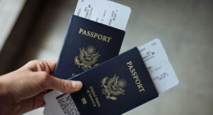 Hand holding passports and tickets